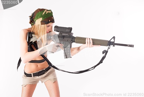 Image of beautiful sexy blond woman with sniper rifle