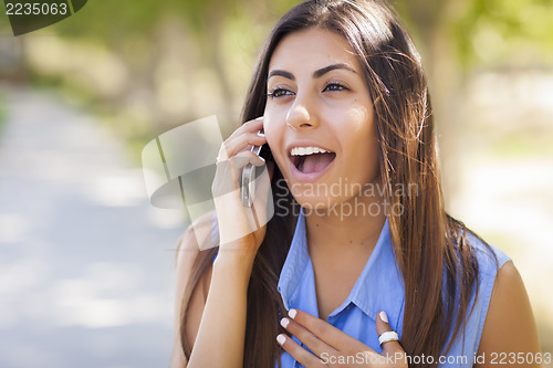 Image of Mixed Race Young Adult Woman Using Her Cell Phone