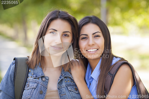 Image of Young Adult Mixed Race Twin Sisters Portrait Outside