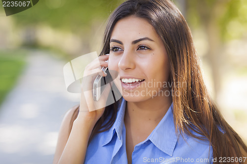 Image of Mixed Race Young Adult Woman Using Her Cell Phone