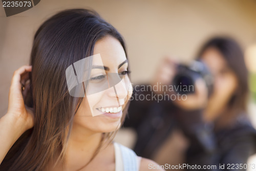 Image of Young Adult Mixed Race Female Model Poses for Photographer