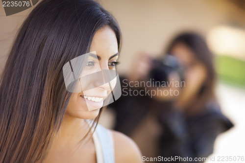Image of Young Adult Mixed Race Female Model Poses for Photographer