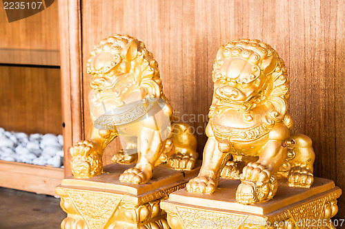 Image of Chinese style figurine golden singha partner
