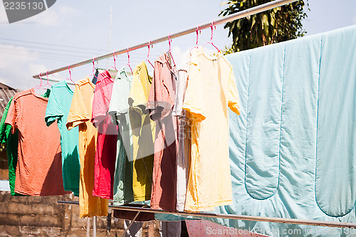Image of Dry clothes in the air with sun light