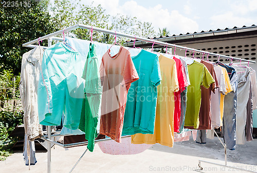 Image of Laundry hanging out to dry outdoors in summer 