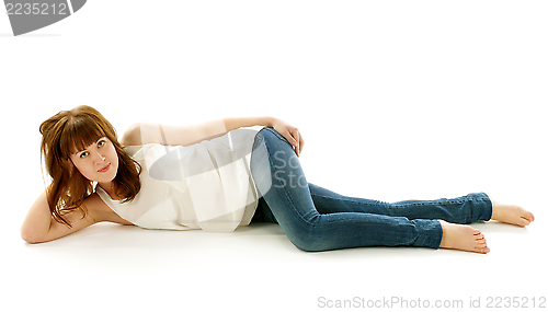 Image of Young Woman in Jeans and Barefoot