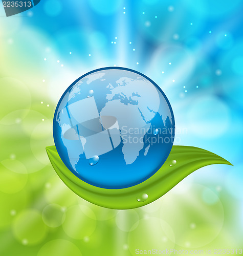 Image of Planet earth with green leaf
