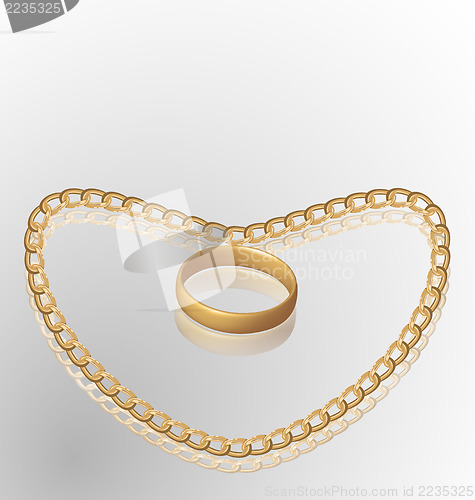 Image of Jewelry ring on golden chain of heart shape