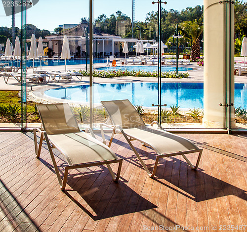 Image of Sunbeds in the indoor swimming pool