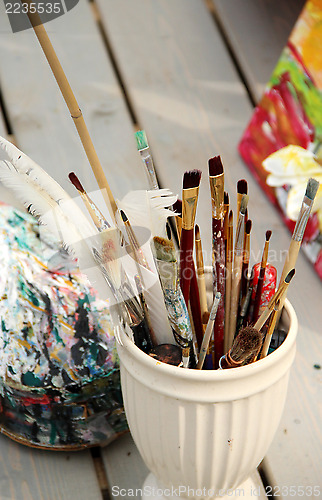 Image of Vivid paintbrushes at the atelier 