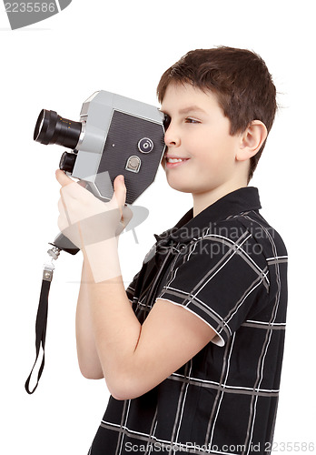 Image of young boy with old vintage analog 8mm camera