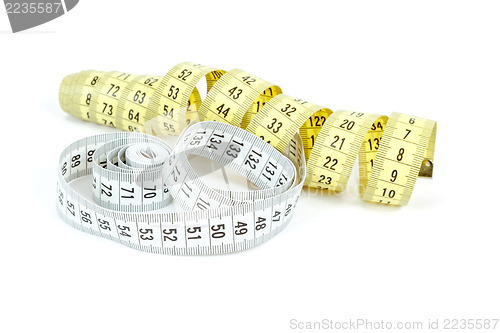 Image of Yellow and white measuring tape isolated on white