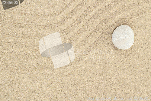 Image of zen stone in sand