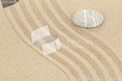 Image of zen stone in sand