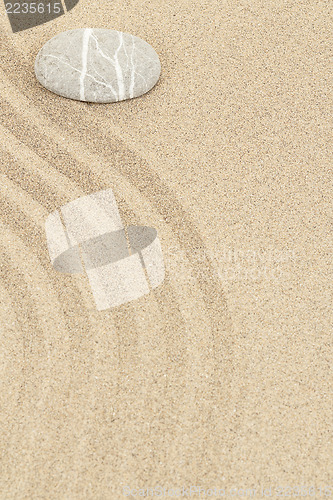 Image of zen stone in sand