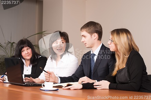 Image of mixed group in business meeting
