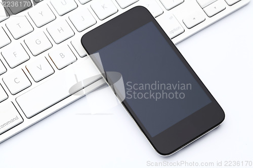 Image of Smartphone on computer keyboard