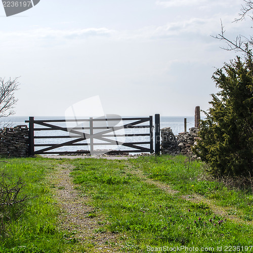 Image of Old wooden gate to the water