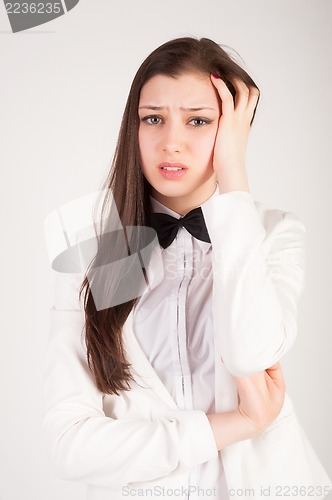 Image of businesswoman with a headache