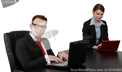 Image of Young Business Couple on Laptops