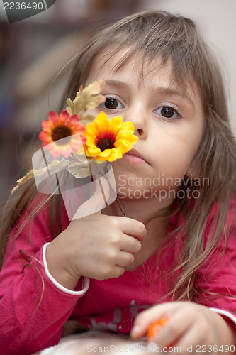 Image of Little girl with flower