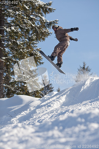 Image of Jump of man snowboarder