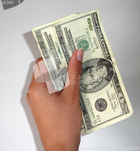 Image of Hand holding money
