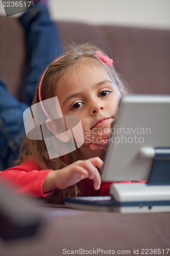 Image of Girl using a laptop for children