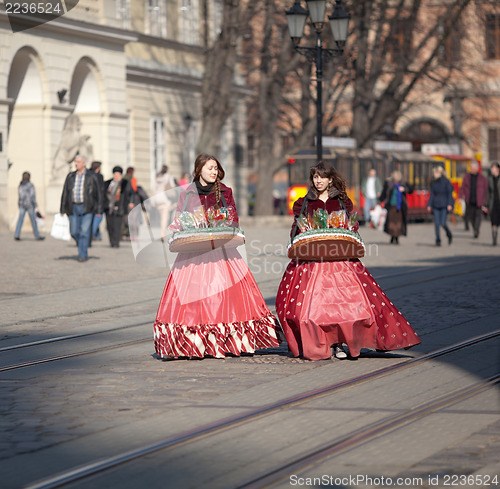 Image of Young girls sell sweets 