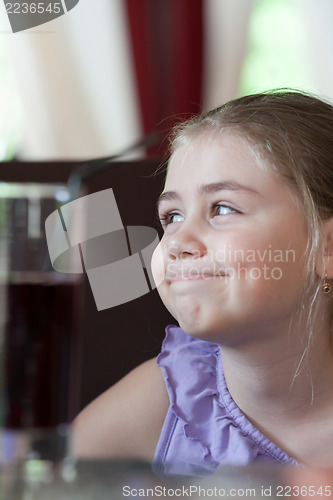 Image of Little girl in cafe