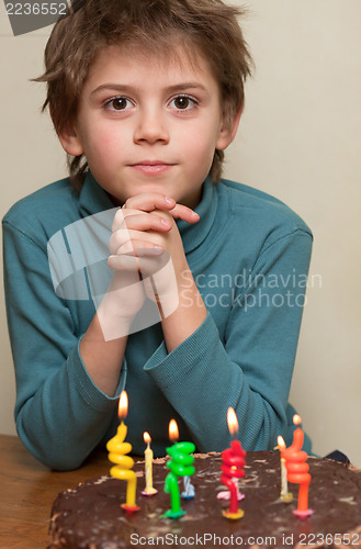 Image of Cute boy at birthday cake