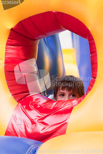 Image of Little girl on inflatable slide