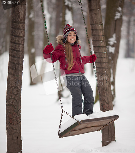 Image of Young girl on a swing