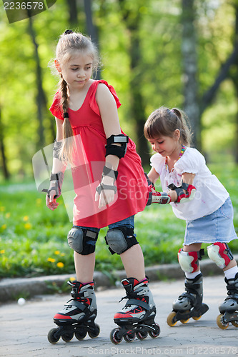 Image of Sisters skating in park