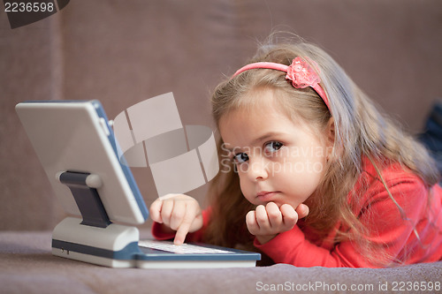 Image of Girl using a laptop for children