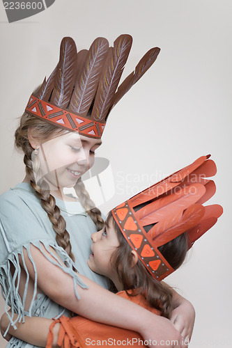 Image of Two little girls playing Indians