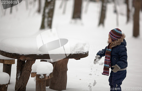 Image of Child explores snow