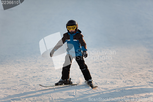 Image of Young boy skiing