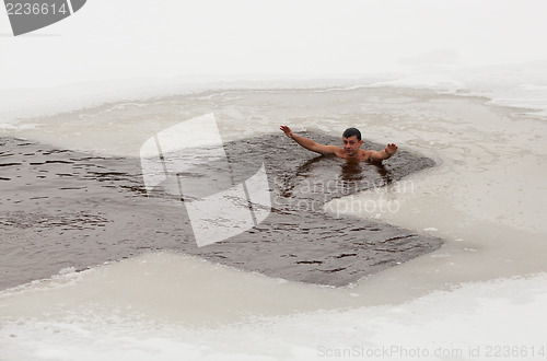 Image of Man in ice cold water