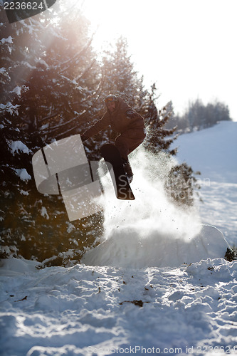Image of Man snowboarder jumping