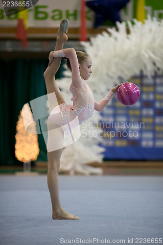 Image of Gymnast girl doing exercise with ball
