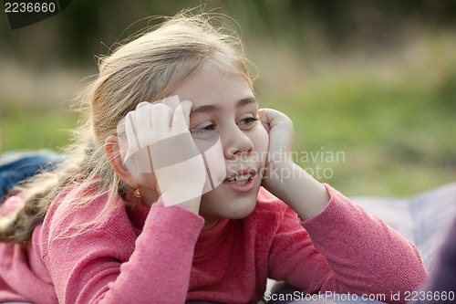 Image of Young girl resting