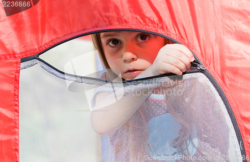 Image of Beautiful little girl in a tent