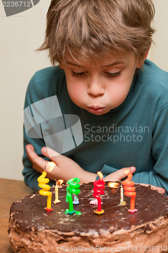 Image of Cute boy at birthday cake