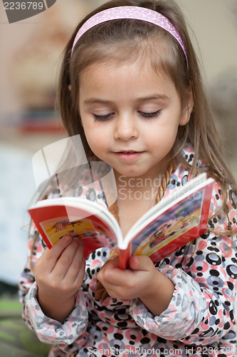 Image of Girl looking at book