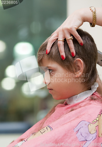 Image of Boy at hairdresser's shop