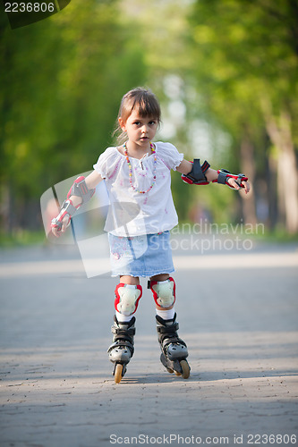 Image of Little girl on roller skates