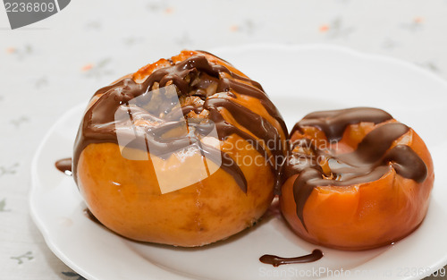 Image of Baked apple and canned peach covered with chocolate