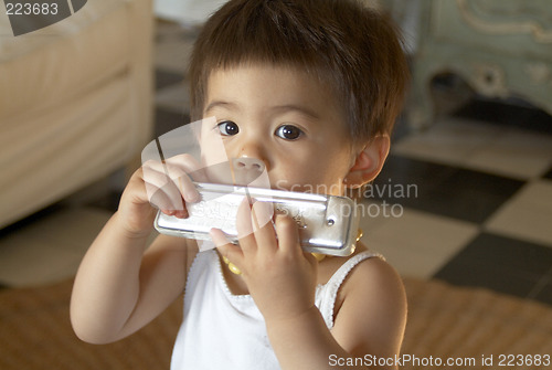 Image of Anael playing harmonica