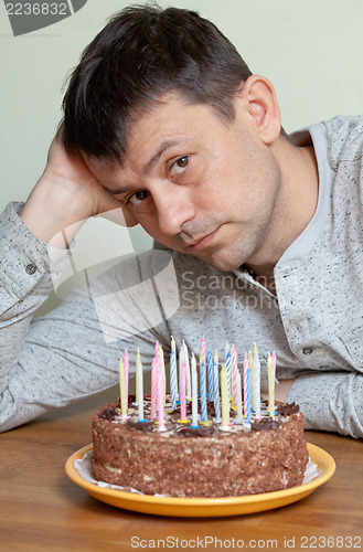 Image of Man at birthday cake